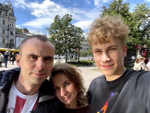 Myhkailo, or Mike, Chabanovskyi, right, poses with his parents Anton and Nataliia during a trip to Kyiv, Ukraine. The photo was taken in June, 2021, two months before Mike traveled to the United States as a high school exchange student. Mike hasn’t seen his parents since.