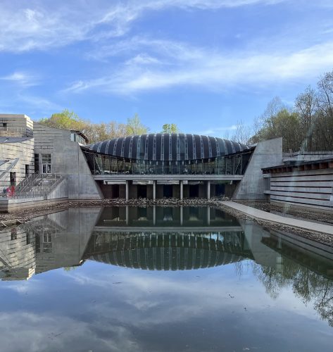 Crystal Bridges Museum of American Art encompasses 200,000 square feet. An addition is being constructed that will add 50 percent to the current space. The arched laminated pine beams of a bridged section of the museum reflects in Jeff Koons’ 3,032-pound suspended heart. Koons is the most expensive living artist; in 2007 one of his hearts sold for $23 million.