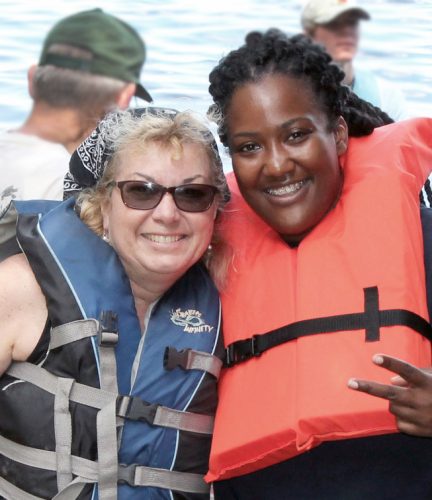 Cindi Berry with student at Elevate Program, preparing to take a paddle. CU File Photo