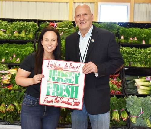 Chelsea Consalo of Consalo Family Farms poses with NJ Secretary of Agiculture Ed Wengryn for the kickoff of another season of growing and distributing Jersey Fresh produce.