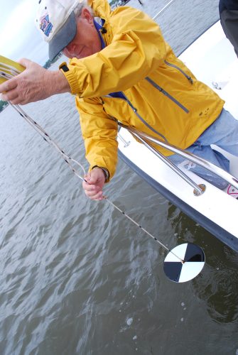 Chesapeake Bay water monitor checks water quality with a Secchi disk. Photo: Chesapeake Bay Executive Order